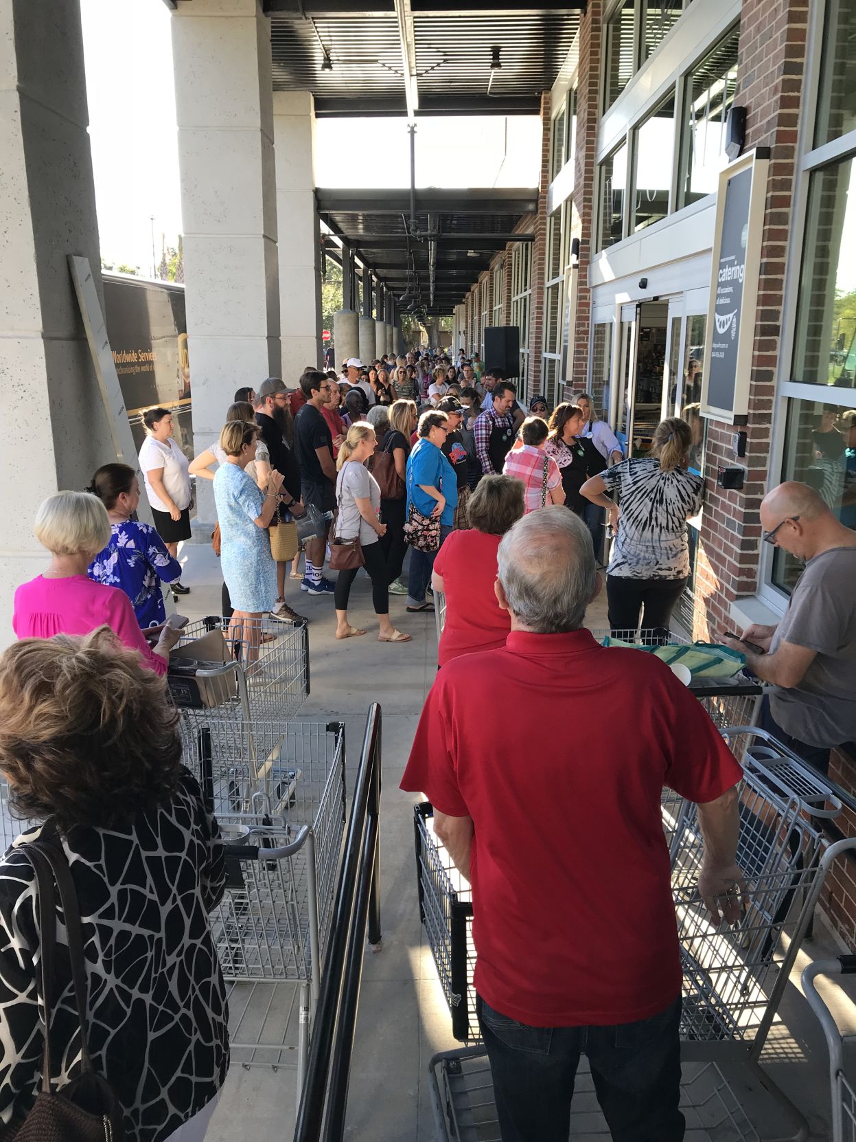 Whole Foods Market customers waiting to get inside new store